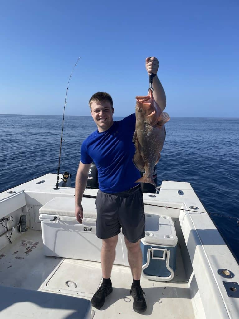 Holding a fish caught charter fishing